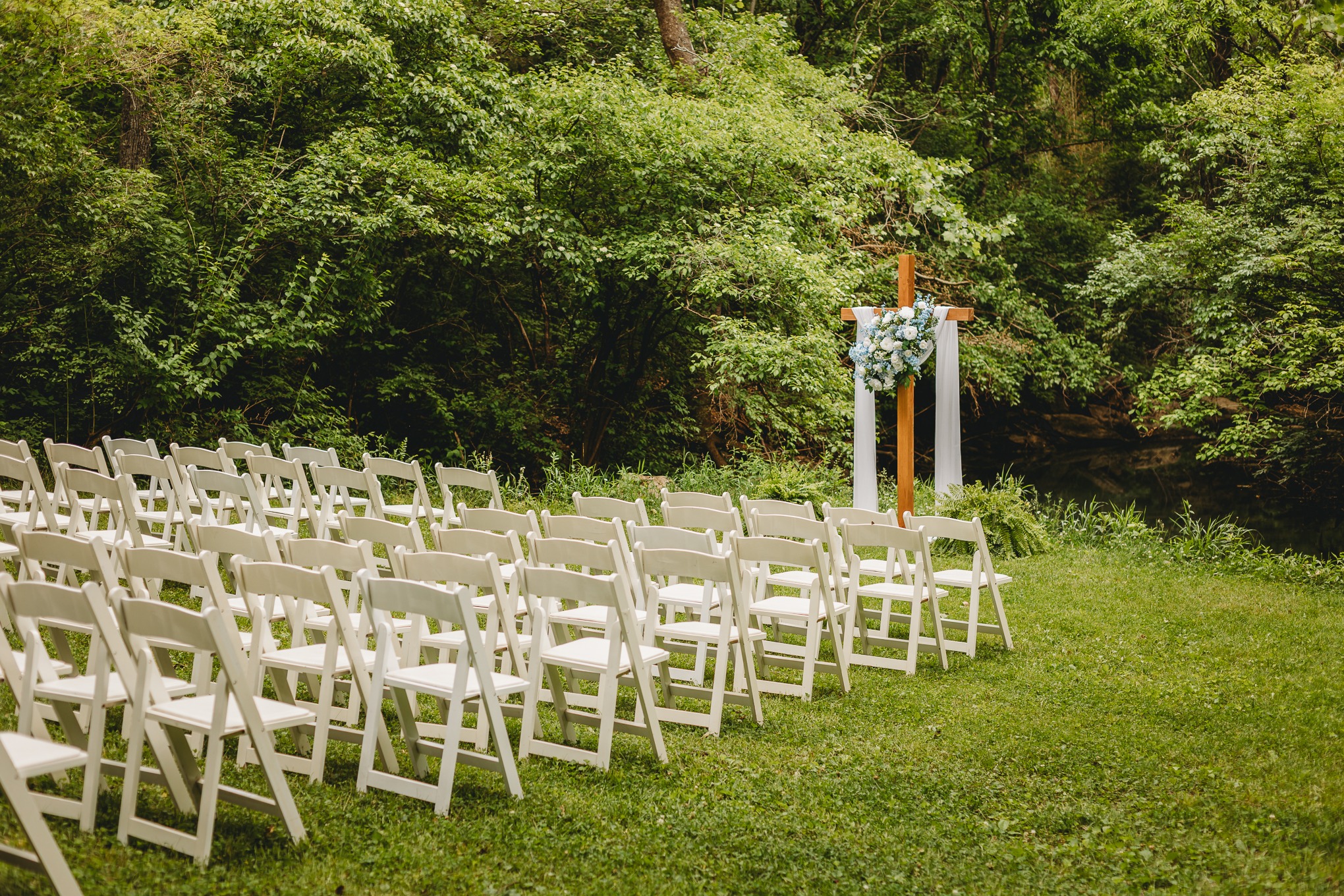 An outdoor wedding ceremony arranged beside the woods