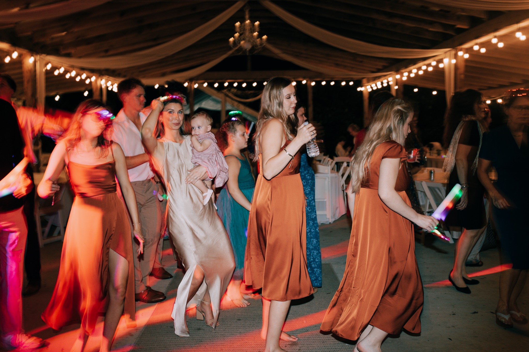 Guests dancing at a lively evening reception